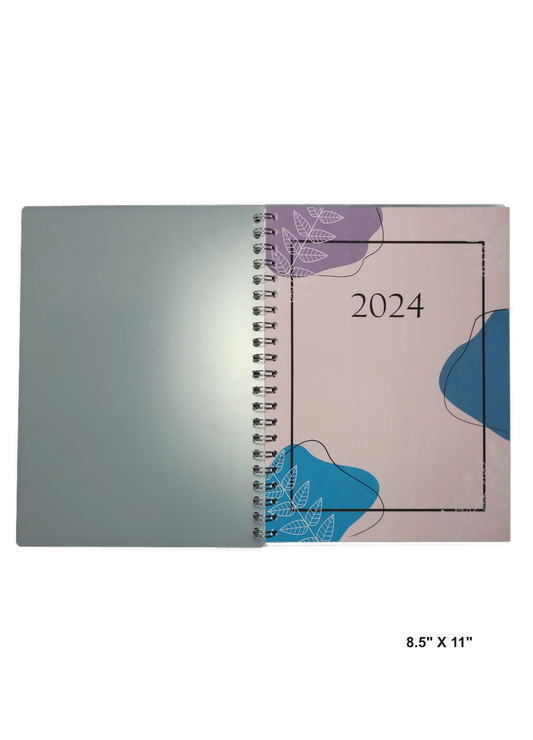 Image of a hand-made 8.5" x 11" 12 month planner with abstract colors. Great for planning and organization.
