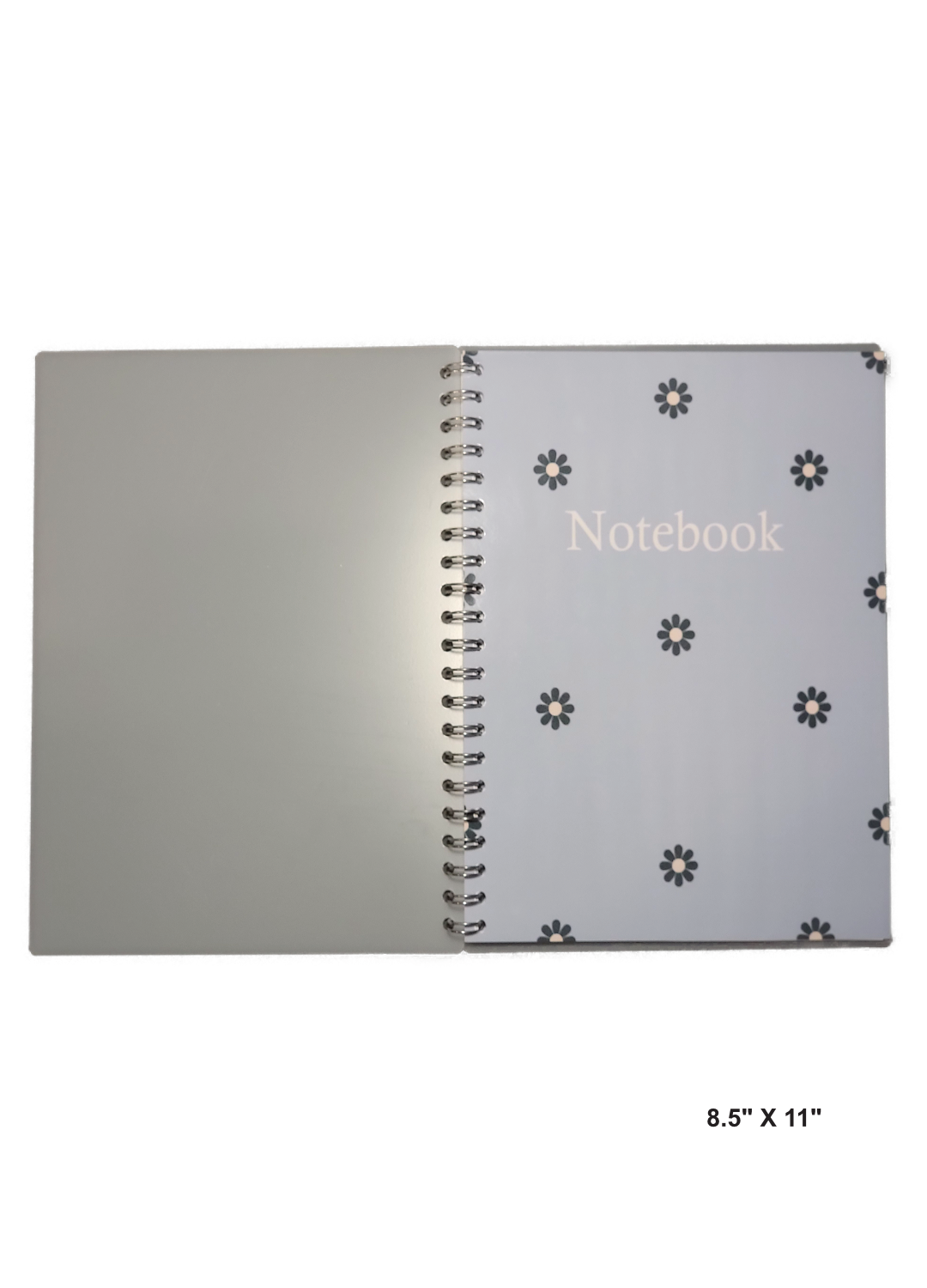 Image of hand-made 8.5" x 11" notebook with blue flowers with a light blue background cover. The notebook's pages are lined for writing or journaling.