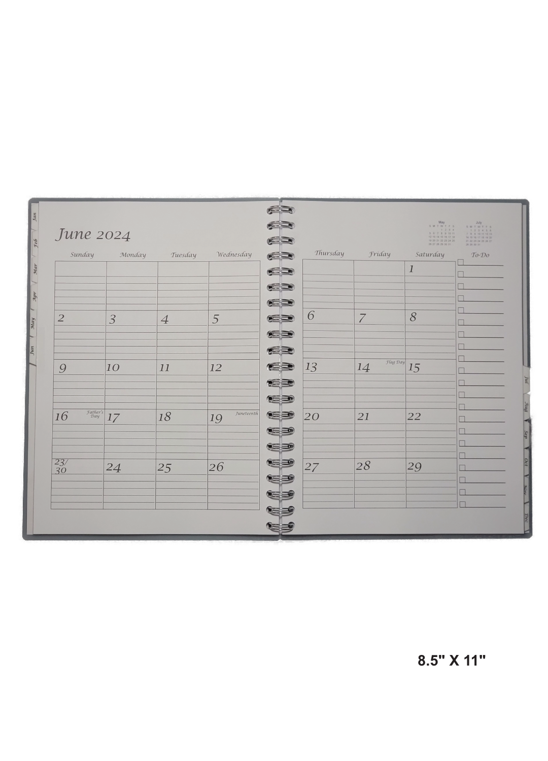 Inside view of a 8.5" x 11" hand-made 12-month planner with a clean and organized layout. Each month has dedicated pages with ample writing space and clear headings. A practical and visually appealing tool for staying organized.