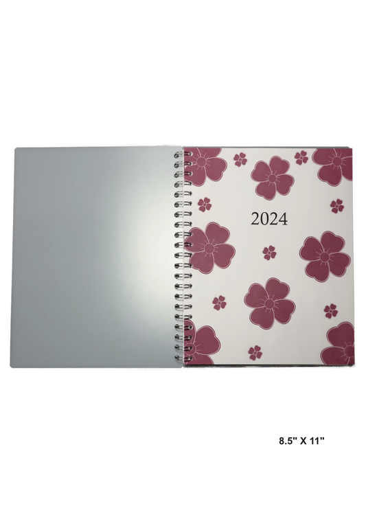 Image of a hand-made 8.5" x 11" 12-month planner with red flowers around the cover. Great for planning and organization.