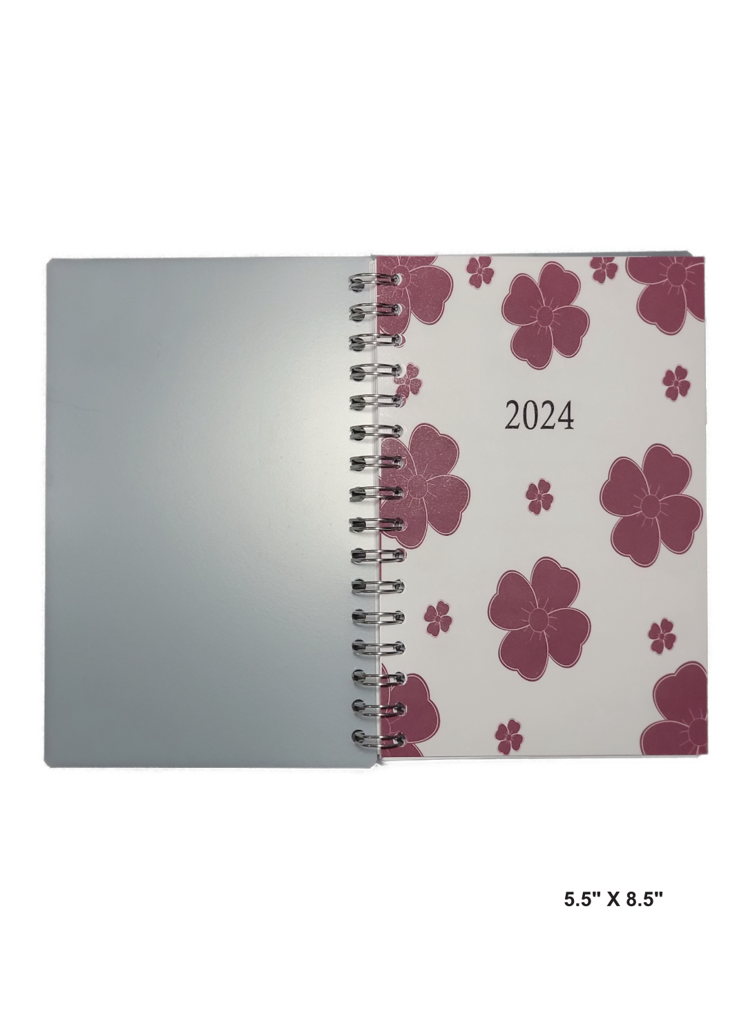 Image of a hand-made 5.5" x 8.5" 12 month planner with red flowers cover. A unique creation for note taking and organization. 