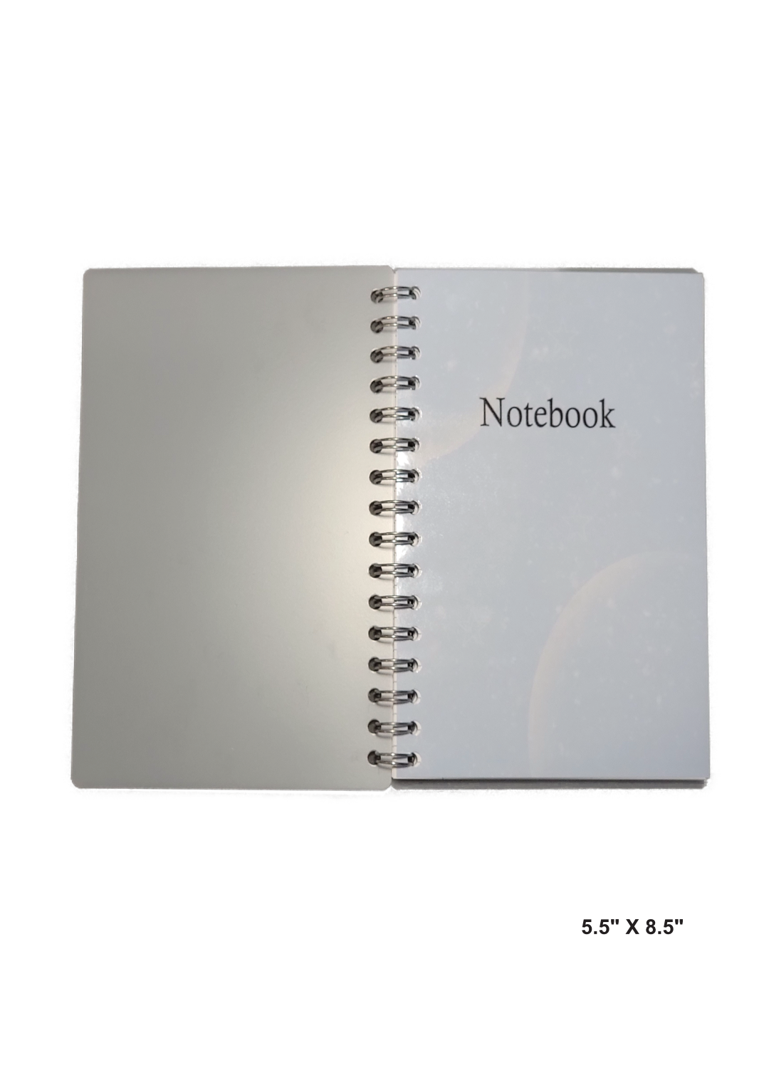 Image of hand-made 5.5" x 8.5" notebook with two moons in each conner making it feel out of space. The notebook's pages are lined for writing or journaling.