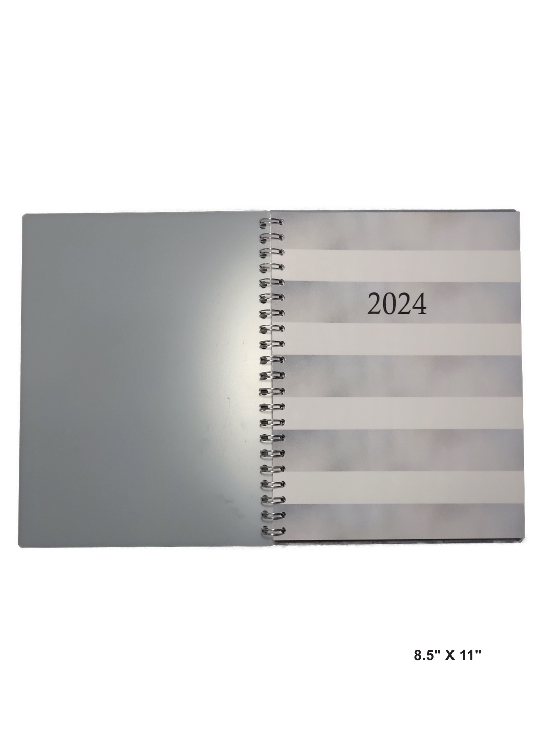 Image of a hand-made 8.5" x 11" 12-month planner with silver and white stripes. Great for planning and organization.