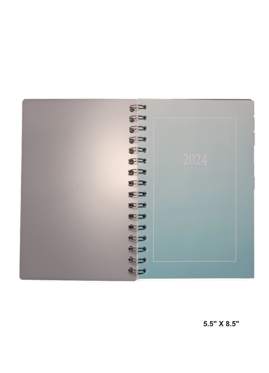 Image of a hand-made 5.5" x 8.5" 12 month planner with ombre teal color. Great for planning and organization.