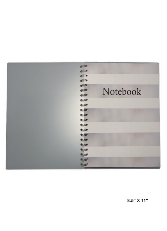 Image of hand-made 8.5" x 11" notebook with silver and white stripes. The notebook's pages are lined for writing or journaling.